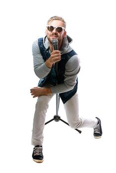man singing with microphone on white photo
