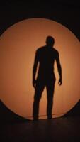 Silhouette of a performer in dynamic movement video