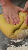 the chef kneads the dough with his hands video