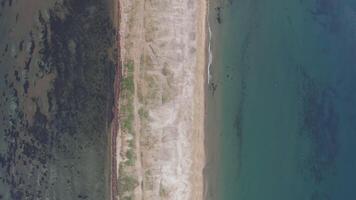 View from a drone vertically down at dawn to the Nazimov sand spit, Russia video