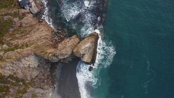 Aerial view from drone 4k camera. Ocean with waves and rocky cliff video