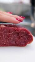 consistency of soft raw meat a piece of beef sliced piece of fresh raw beef during salting, preparation of semi-finished products with beef meat with salt video