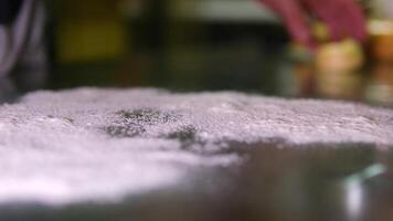 Sprinkling flour on table, super slow motion, sprinkle flour on the table video