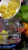 pasta nests Cooking process Step by step Water boils in a saucepan as nests of thin pasta are added to cook delicate spaghetti. Thin spaghetti noodles in the shape of a nest. instant noodles video
