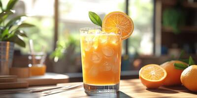 Freshly prepared orange drink garnished with a slice and mint in bright cafe ambiance photo