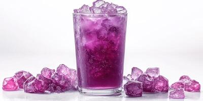 Refreshing purple drink served in a clear glass with ice cubes scattered around on a white background photo