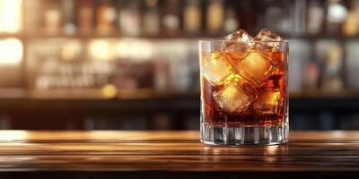 Refreshing drink served with ice in a glass on a wooden countertop during evening ambiance at a bar photo