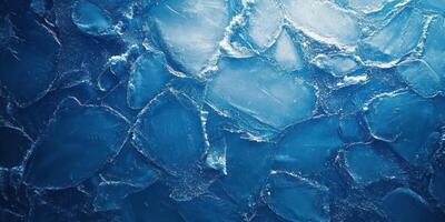 Icebergs floating in a deep blue ocean showcasing stunning natural patterns and textures during a clear day photo