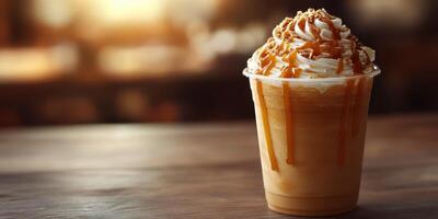 Creamy caramel frappuccino with whipped cream in a cozy cafe setting during golden hour photo