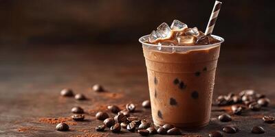 Iced chocolate drink with coffee beans and cocoa powder on a rustic wooden surface photo