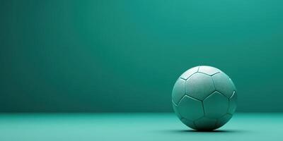 Green soccer ball placed on a smooth surface in a minimalistic setting for creative sports-themed design options photo