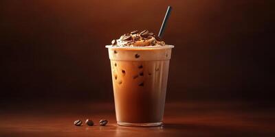 Chocolate coffee shake with whipped cream and chocolate shavings served in a transparent glass cup on a wooden table photo