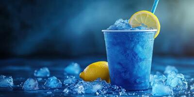Cool blue slushy with lemon slice on top surrounded by ice cubes in a dimly lit setting photo
