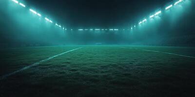 Illuminated soccer field ready for match under soft blue lighting on a foggy night photo