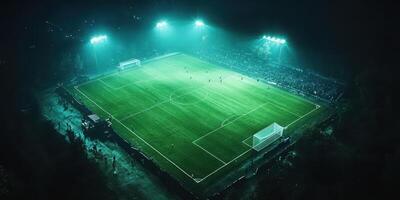 Intense night soccer match under bright stadium lights at a bustling sports field photo