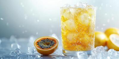 Refreshing sparkling beverage with passion fruit and ice cubes served in a glass on a cool surface photo