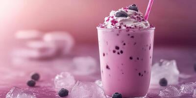 Delicious berry milkshake served with whipped cream and ice, perfect for summer refreshment photo