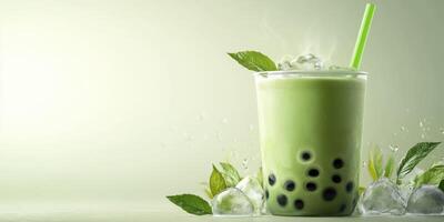 Refreshing green tea bubble drink served with ice and mint leaves on a light background photo