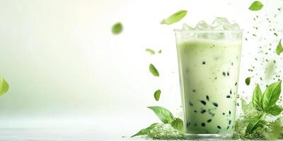 Refreshing green tea drink with ice and mint on a light background for a cool evening refreshment photo