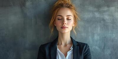 Woman experiences calmness and tranquility in a serene indoor setting during a quiet moment of meditation photo