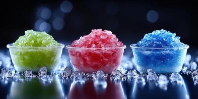 Colorful frozen treats displayed on a reflective surface with ice crystals in a dark setting photo