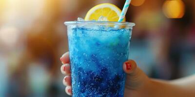 Refreshing blue drink served with a lemon slice in a cozy setting on a sunny afternoon photo