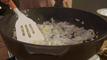 Sliced shitake mushrooms or champignon mushrooms are added to chopped onions that are fried in pan in olive oil to create delicious homemade dish. video