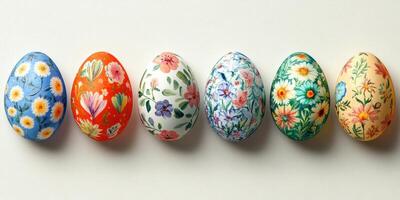 Colorful decorative Easter eggs arranged in a row featuring intricate floral designs and vibrant colors photo