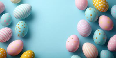 Colorful Easter eggs arranged on a blue background celebrating spring festivities in a creative decoration display photo