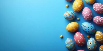 Colorful Easter eggs decorated with patterns arranged on a bright blue background for a festive atmosphere photo