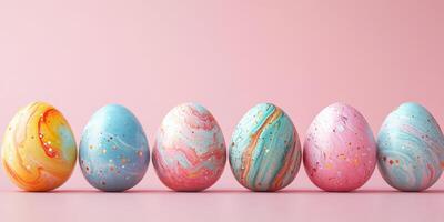 Colorful marbled eggs arranged on a pastel pink surface during a spring celebration photo