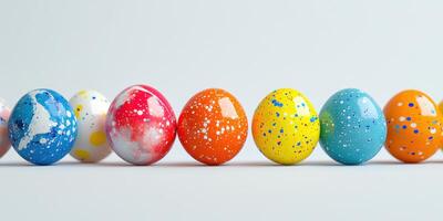 Colorful decorated eggs lined up on a smooth surface celebrating a festive occasion photo