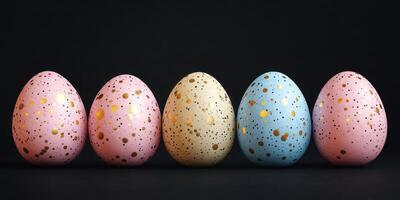 Colorful speckled eggs arranged in a line against a dark background for a festive celebration photo