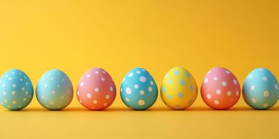 Colorful polka dot Easter eggs arranged on bright yellow background for festive decoration photo