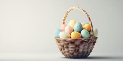 Colorful pastel Easter eggs in a woven basket arranged artistically for spring celebration photo