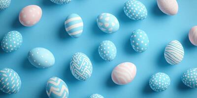 Colorful decorated eggs in various patterns scattered on a light blue background for spring festivities photo
