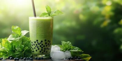 Refreshing mint bubble tea with green smoothie and blueberries on wooden table surrounded by greenery photo