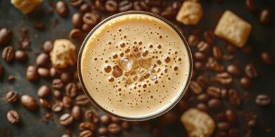 Creamy coffee drink topped with froth and surrounded by coffee beans in a cozy setting photo