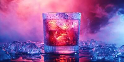Colorful cocktail with ice in illuminated glass on a reflective surface at a party setting photo