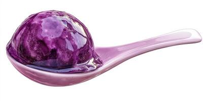 Delicious purple ice cream served on a spoon with a smooth texture and vibrant color photo