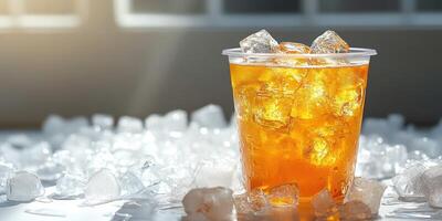 Refreshing iced beverage served in a clear cup with ice on a bright table surface during late afternoon light photo