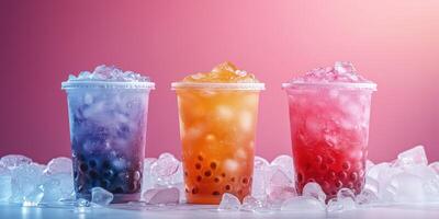 Colorful bubble tea drinks with ice against a vibrant backdrop during a warm afternoon photo