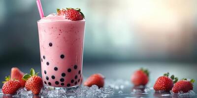 Refreshing strawberry bubble tea served with fresh strawberries and ice on a bright surface in a casual setting photo