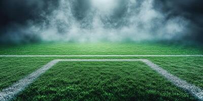 Empty soccer field under dramatic lighting and fog during dusk in a quiet stadium photo
