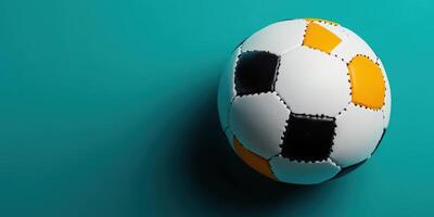 Colorful soccer ball on a solid teal background showcasing the sport's dynamic essence and playfulness photo