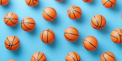 Orange basketballs scattered across a blue background create a vibrant and playful atmosphere in this sports-themed composition photo
