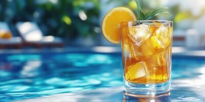 Refreshing cocktail on a sunny day by the pool with vibrant colors and ice cubes melting in a glass of tropical delight photo