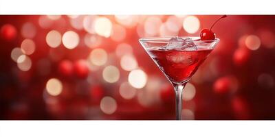 Red cocktail in a glass garnished with a cherry, surrounded by a soft bokeh background photo