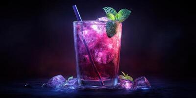 Colorful refreshing cocktail garnished with mint leaves in a dark setting photo