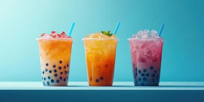 Refreshing bubble tea options on a bright blue background featuring colorful drinks with ice and tapioca pearls photo